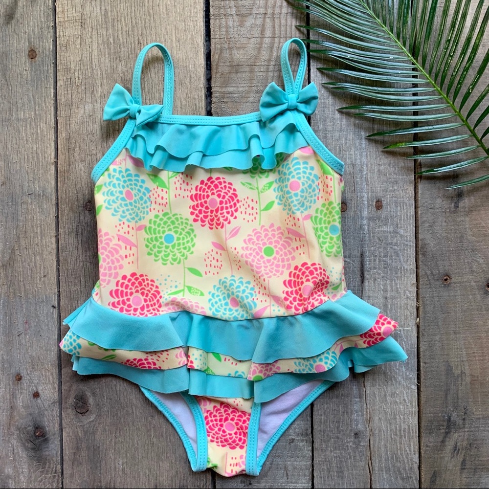 Floral swimsuit with ruffle trim. EUC - Size 2T